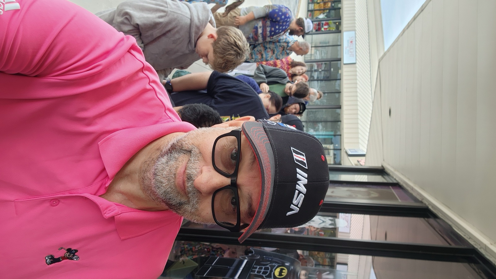 Waiting in line at the grand opening  -  IMSA hat on, LEGO on the brain