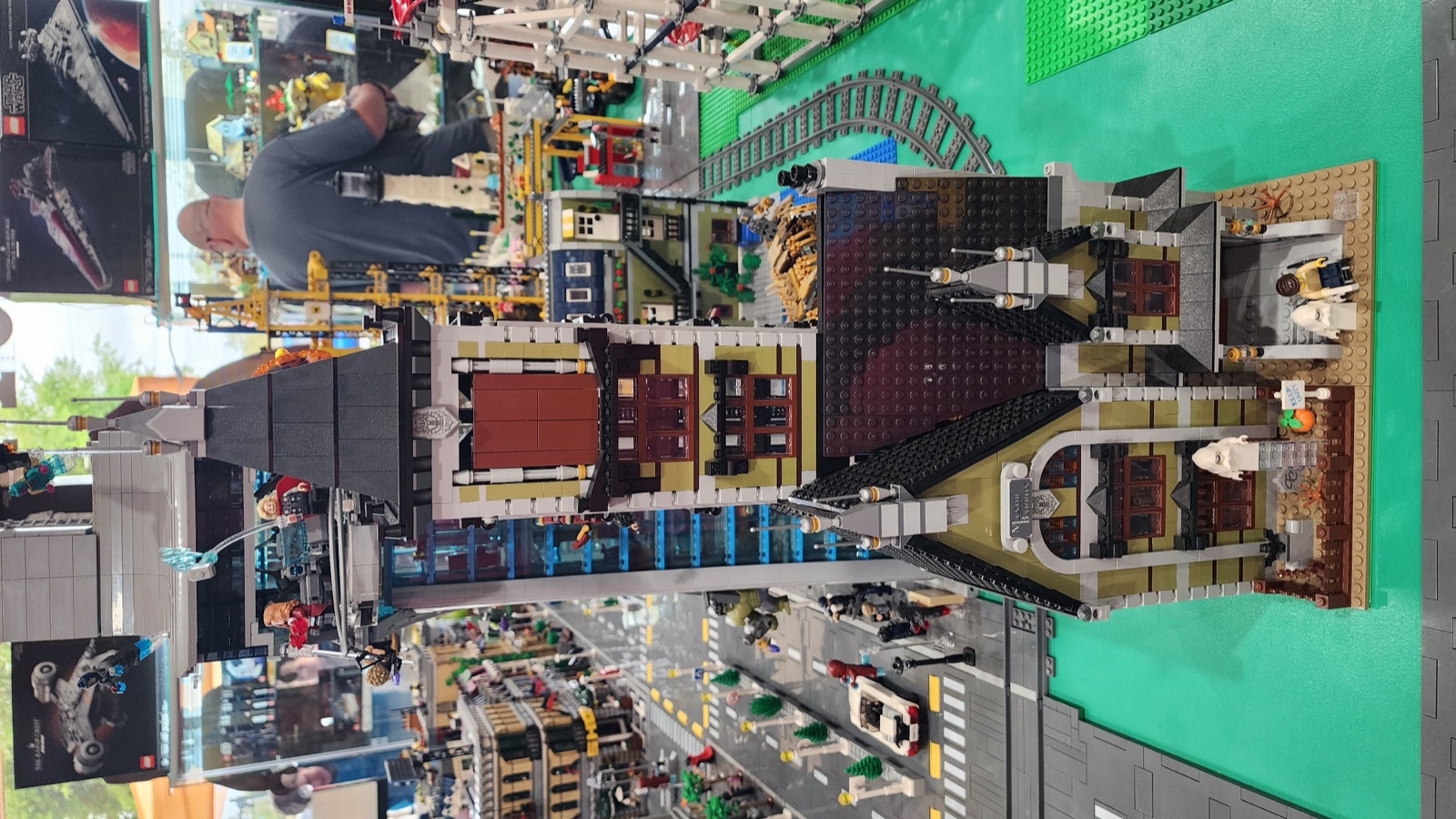 Dark buildings section and roller coaster track visible behind