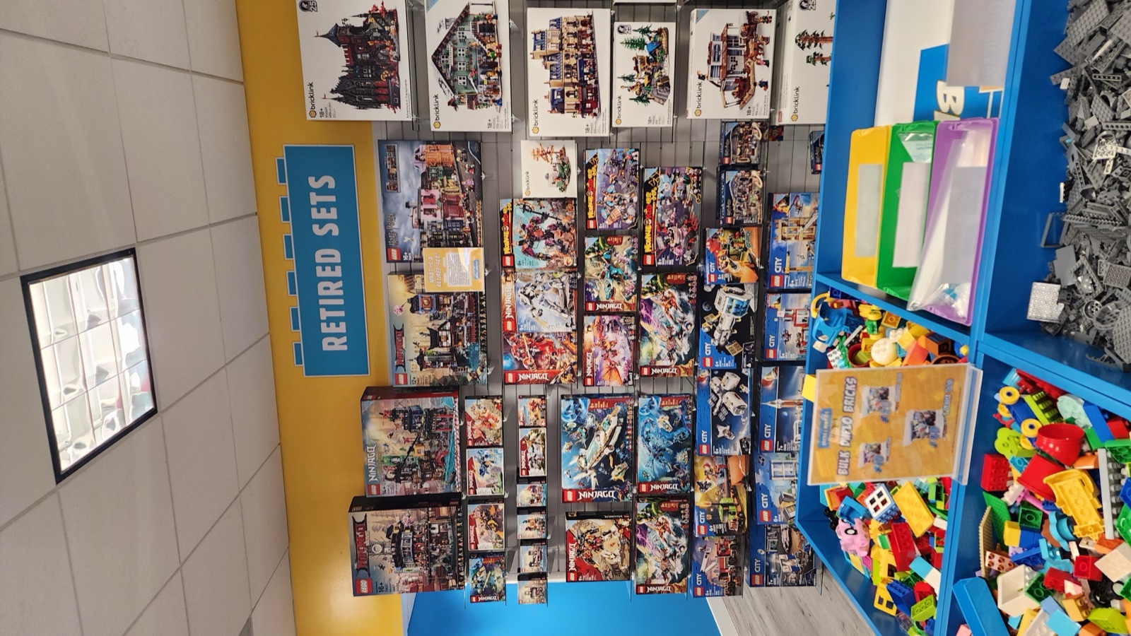Wall of retired LEGO sets  -  Ninjago, Star Wars, and more