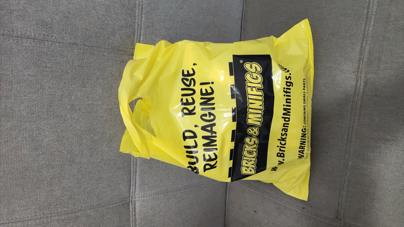 The yellow Bricks and Minifigs bag  -  Rebuild, Reuse, Reimagine