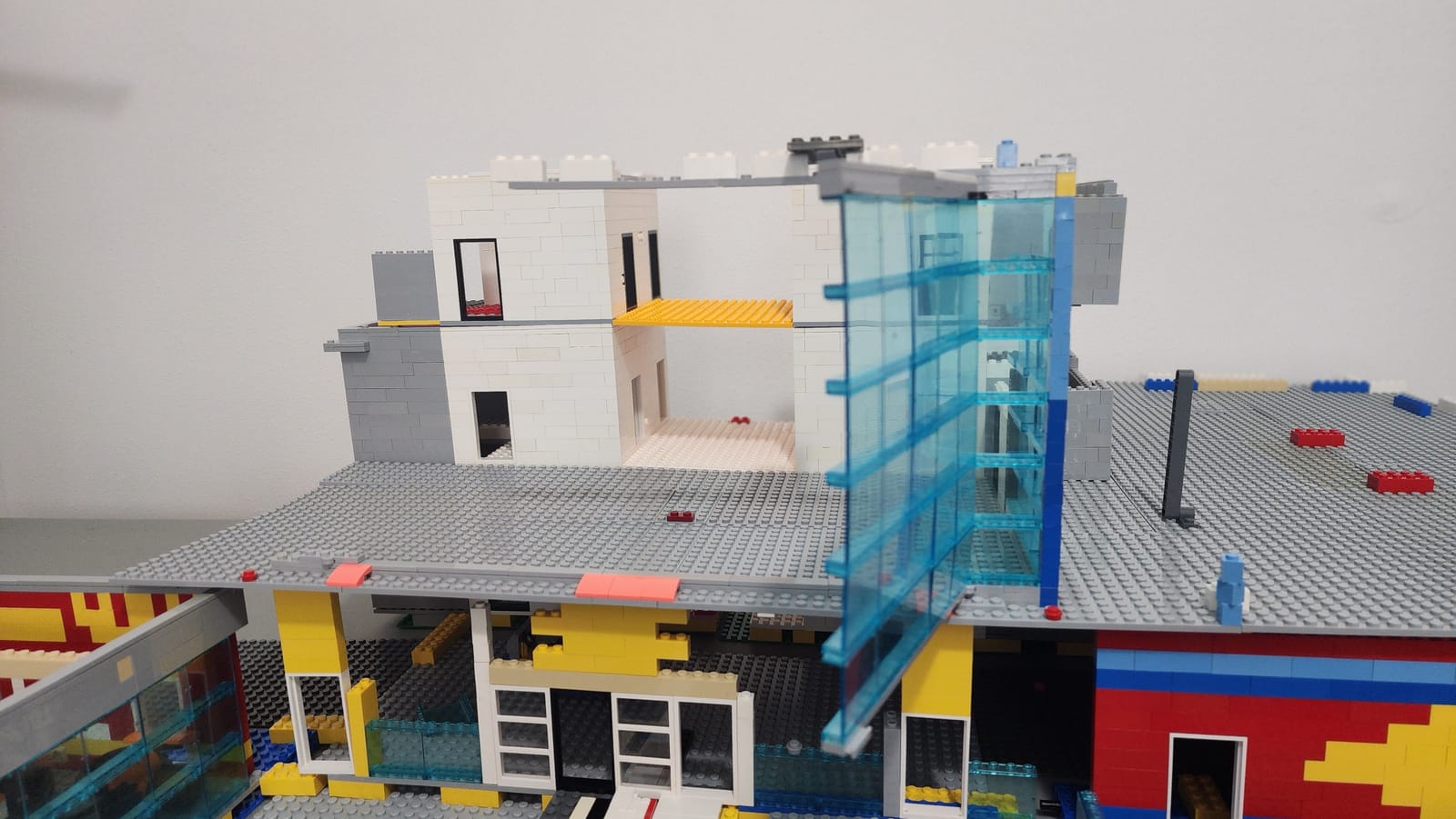 The IMS Pagoda LEGO reveal feature showing the opened wall exposing the core tower with elevators and stairs, three stories visible