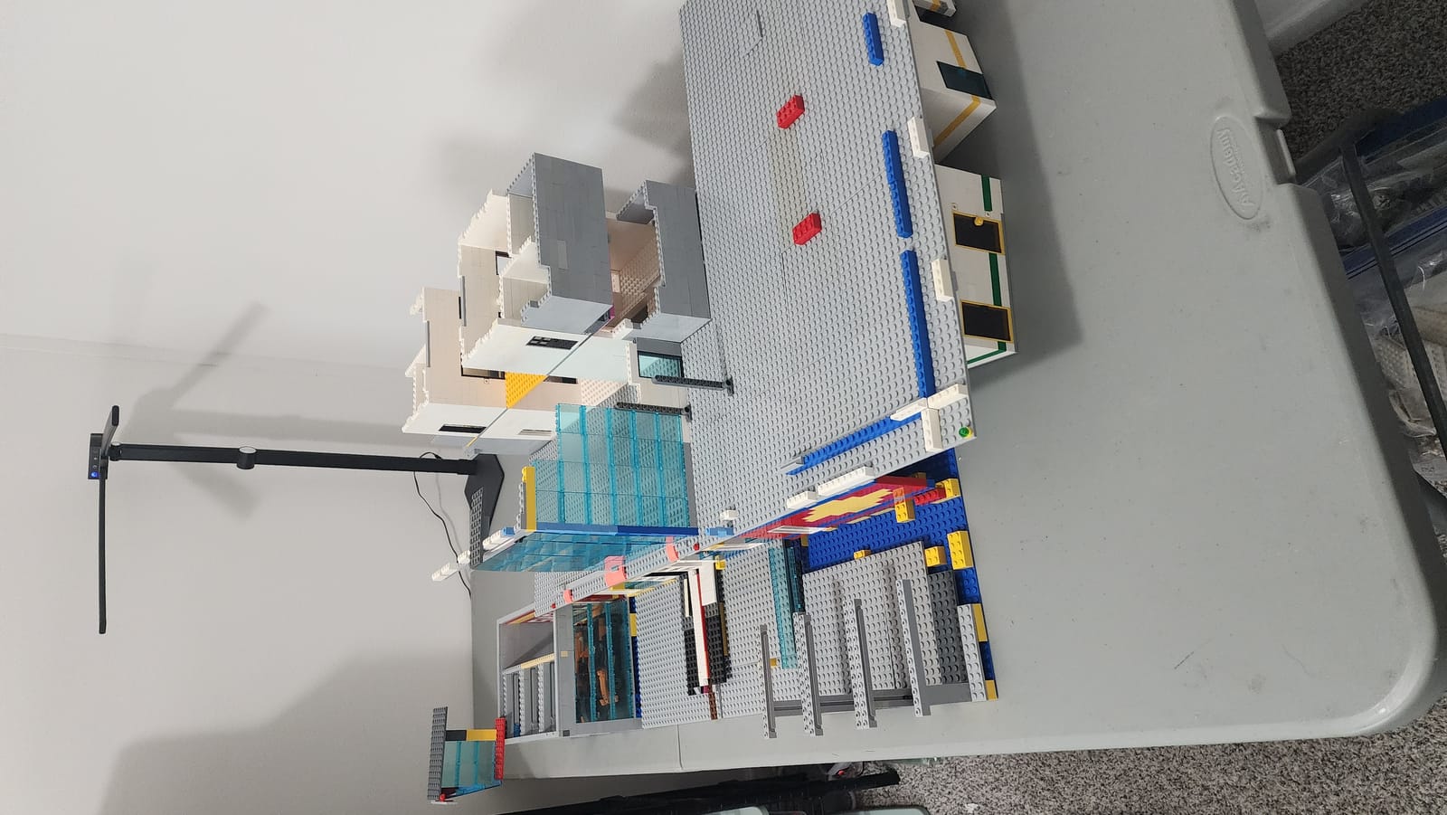 Top-down angle of the IMS Pagoda LEGO build showing steel beam locations and structural column placement on the ground floor